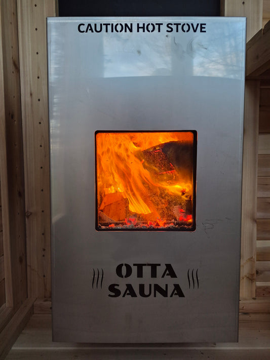 Exterior fed wood sauna stove
